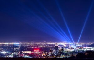 Huge spotlight rays over city