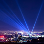 Huge spotlight rays over the night panorama of Houston