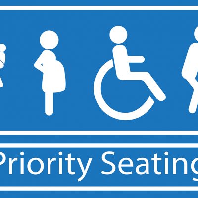 Priority seating sign.  Disability, elderly, pregnant and woman